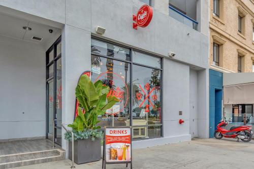 a dunkin donuts store with a sign in front of it at Ocean View Hotel in Los Angeles