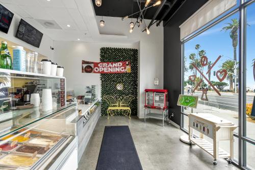 a store with a stand up opening sign on the wall at Ocean View Hotel in Los Angeles
