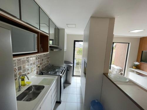 Η κουζίνα ή μικρή κουζίνα στο Apartamento próximo a praia - Ecogarden