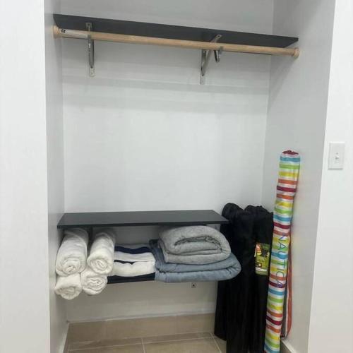 a closet with a shelf with towels on it at Sweet Sunset 4 Playa Rompeolas, Aguadilla in Aguadilla