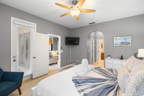a bedroom with a bed and a ceiling fan at Lux 4BrVilla Hot Tub Grill Private Heated Pool in Kissimmee