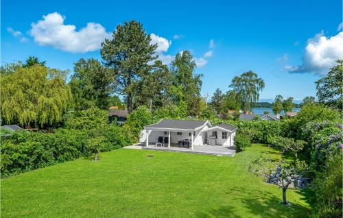 an aerial view of a white house with a large yard at 2 Bedroom Beautiful Home In Jægerspris in Jægerspris