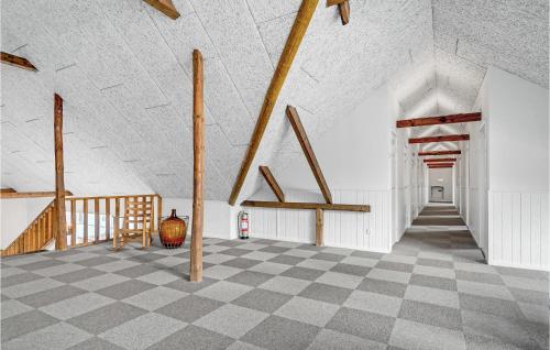 a room with a checkered floor and a staircase at Lovely Home In Vorbasse With Kitchen in Vorbasse