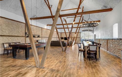 a room with a ping pong table and chairs at Lovely Home In Vorbasse With Kitchen in Vorbasse
