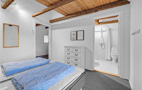 a white bedroom with a bed and a bathroom at Lovely Home In Vorbasse With Kitchen in Vorbasse