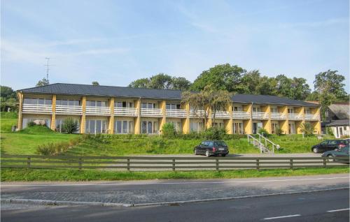 a large building on the side of a road at Lovely Apartment In Allinge With Wifi in Allinge