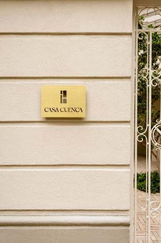 a sign on the side of a building at Hotel Casa Cuenca in Mexico City
