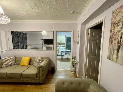 a living room with a couch and a table at Semi Detached House in Aldershot in Aldershot