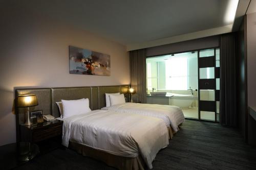 Ein Bett oder Betten in einem Zimmer der Unterkunft Hotel Geight Taipei