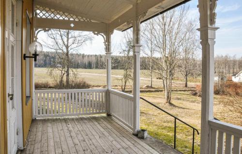 an open porch with a view of a field at Stunning Home In Värmlands Nysäter in Varmlands Nysater