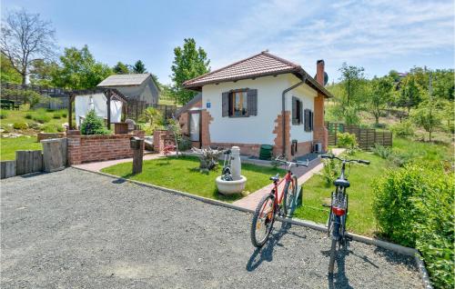 a couple of bikes parked in front of a house at Lovely Home In Beretinec With Wifi in Beretinec