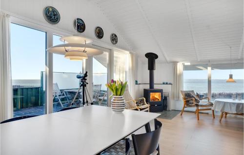a living room with a view of the ocean at Gorgeous Home In Esbjerg V in Esbjerg