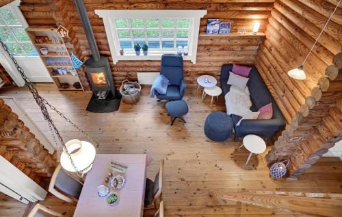 an overhead view of a living room in a log cabin at 2 Bedroom Cozy Home In Mariager in Mariager
