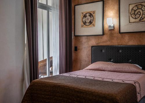 Postel nebo postele na pokoji v ubytování Hotel María de la Luz