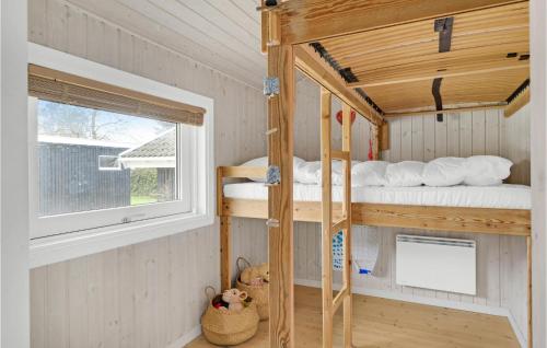 a room with two bunk beds and a window at Amazing Home In Gilleleje With Wifi in Gilleleje