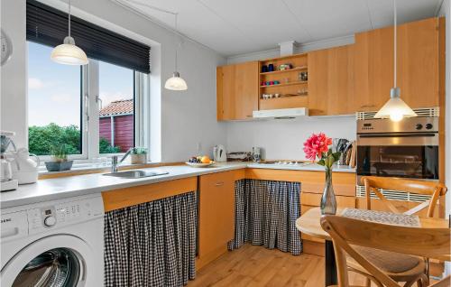 a kitchen with a washer and dryer at One-Bedroom Holiday Home In Ribe in Ribe