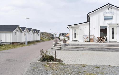 a row of white houses on a street at 1 Bedroom Stunning Home In Vrångö in Vrångö