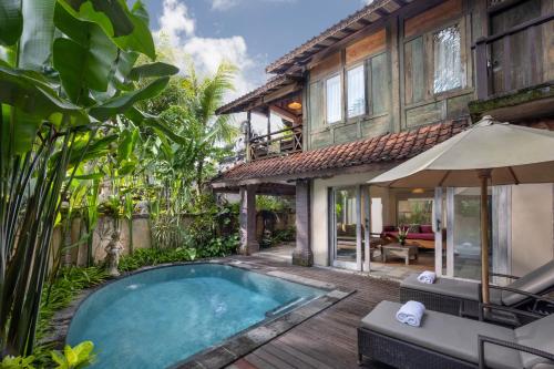 an image of a villa with a swimming pool at Pramana Watu Kurung in Ubud