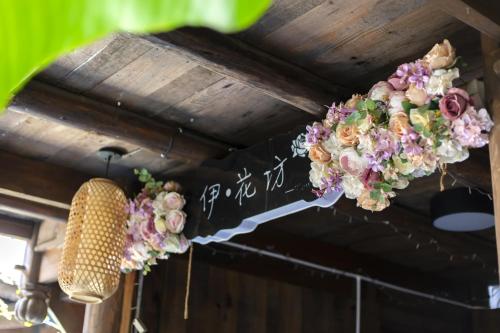 a flower garland hanging from a ceiling at Butterfly Flowers Inn in Zhangjiajie