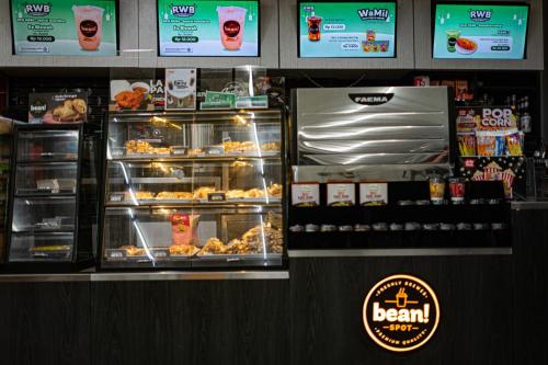 a bakery with a display of food in a store at Casa Residence Bali By Bali Cabin in Kerobokan
