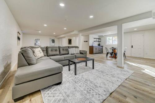 a living room with a couch and a table at Palmer Pointe Heights Colorado Adventure Home Base WiFi, AC & Pets in Colorado Springs