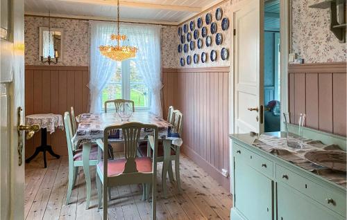 a dining room with a table and chairs at Pet Friendly Home In Smøla With Wifi in Smøla