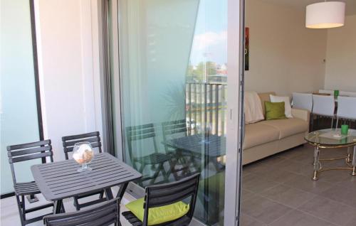 a balcony with a table and chairs and a couch at Residentie Crystal Ref 93 in Ostend