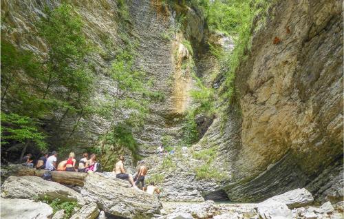 a group of people sitting on rocks in a canyon at Alla Cocca in San Donato