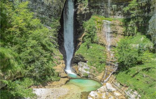 an aerial view of a waterfall in a canyon at Alla Cocca in San Donato