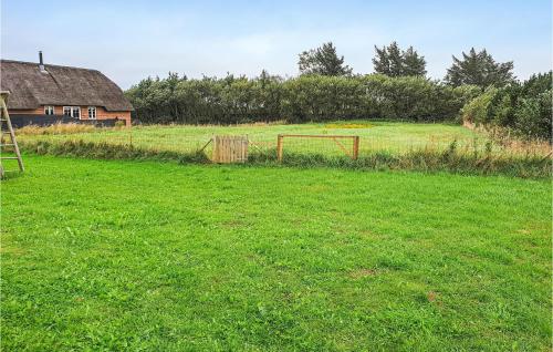 a field of grass with a soccer goal in it at Four-Bedroom Holiday Home In Ulfborg in Øhuse