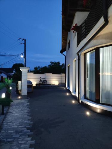 a building with lights on the side of it at Regal Guest House in Sighetu Marmaţiei
