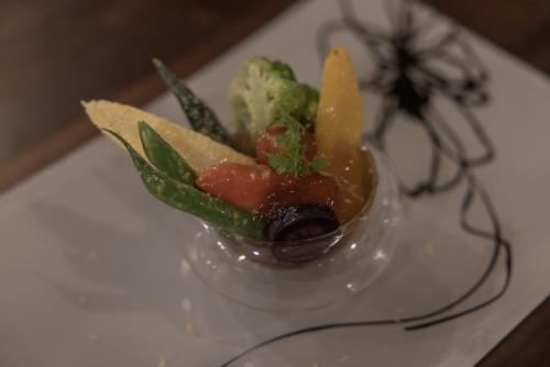 a small glass bowl of food on a table at ruisseau in Ogawa