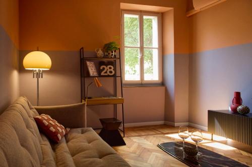 a living room with a couch and a window at Zelda in Udine