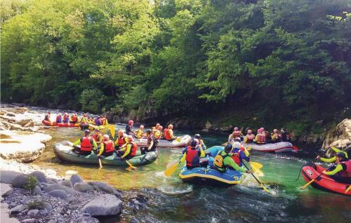 a group of people are rafting down a river at Gorgeous Home In Bagni Di Lucca Lu in Bagni di Lucca