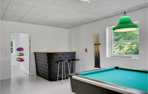 a room with a pool table and a green lamp at Lovely Home In Grindsted With Wifi in Grindsted