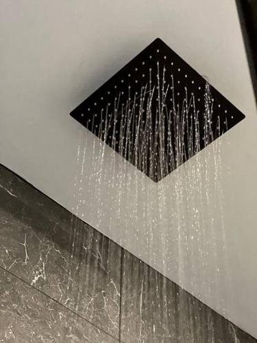 a black triangle on the ceiling of a bathroom at Casa Santiago - Zona Exclusiva in Guanajuato