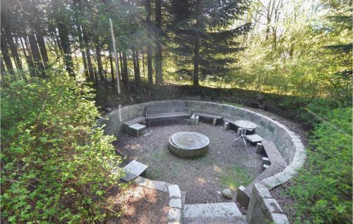 an overhead view of a park with a bench and tables at Three-Bedroom Holiday Home In Spottrup in Spottrup