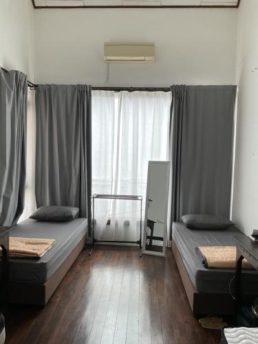 A bed or beds in a room at Homs Female Hostel