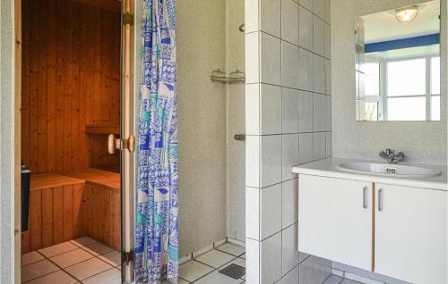 a bathroom with a shower and a sink at Holiday Home Nørre Nebel 37 in Lønne Hede