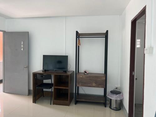 Una televisión o centro de entretenimiento en M.I.N.D. Villa