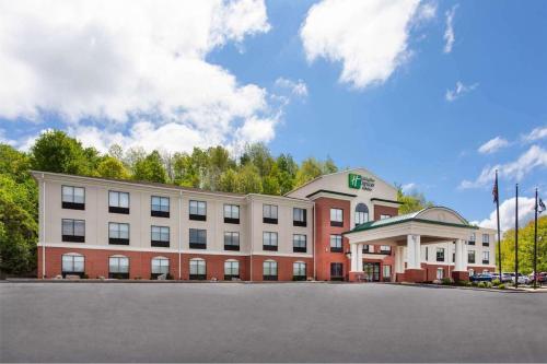 a large red building with a white building at Holiday Inn Express Hotel & Suites Dubois by IHG in DuBois
