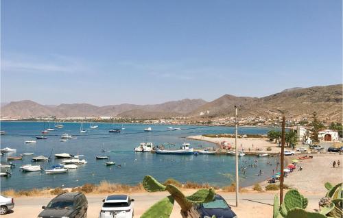 a group of boats in a harbor with a beach at 6 Bedroom Beautiful Home In La Azohia in La Azohía