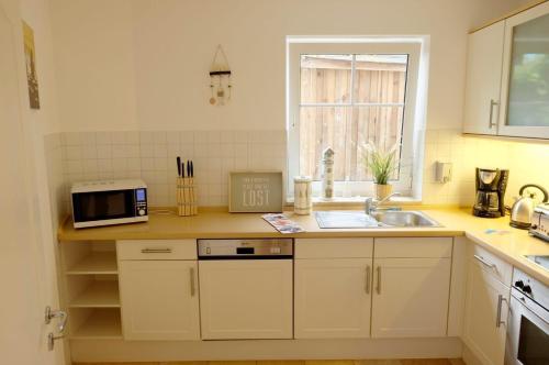 Kuchyň nebo kuchyňský kout v ubytování Ferienhaus Robert
