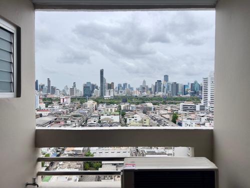 a view of a city skyline from a window at BU Place Hotel in Bangkok