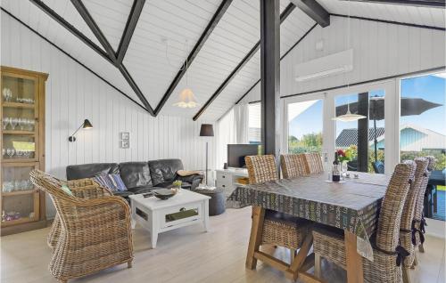 a living room with a couch and a table at Holiday Home Teglbakken Egernsund I in Egernsund