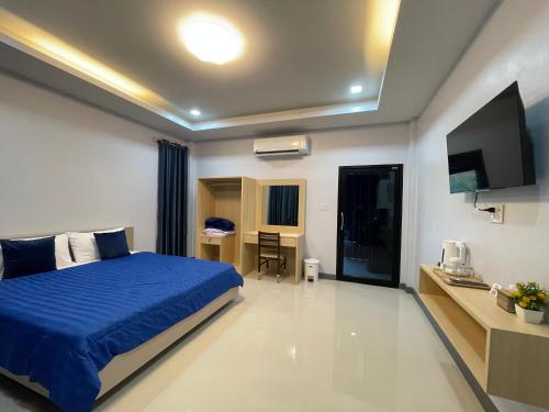 Postel nebo postele na pokoji v ubytování IBC Home ที่พักฮาลาล นครศรีธรรมราช