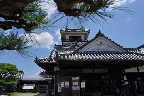 a building with a clock tower on top of it at Guest House BONITO in Kochi
