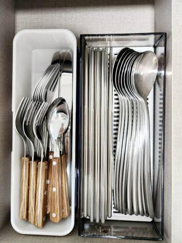 a container filled with utensils sitting on a counter at Breathe Hanok Village Nambu Market in Jeonju