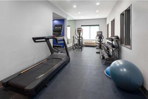 a gym with tread machines and an exercise ball at Holiday Inn Express Hotel & Suites Dubois by IHG in DuBois