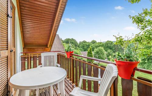 a porch with a table and chairs on a deck at Ferienhaus 12 In Kirchheim in Kirchheim